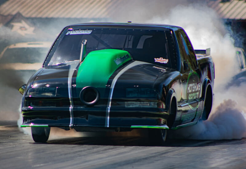 Hot Shot's Secret Firepunk S10 truck in action during a drag race.